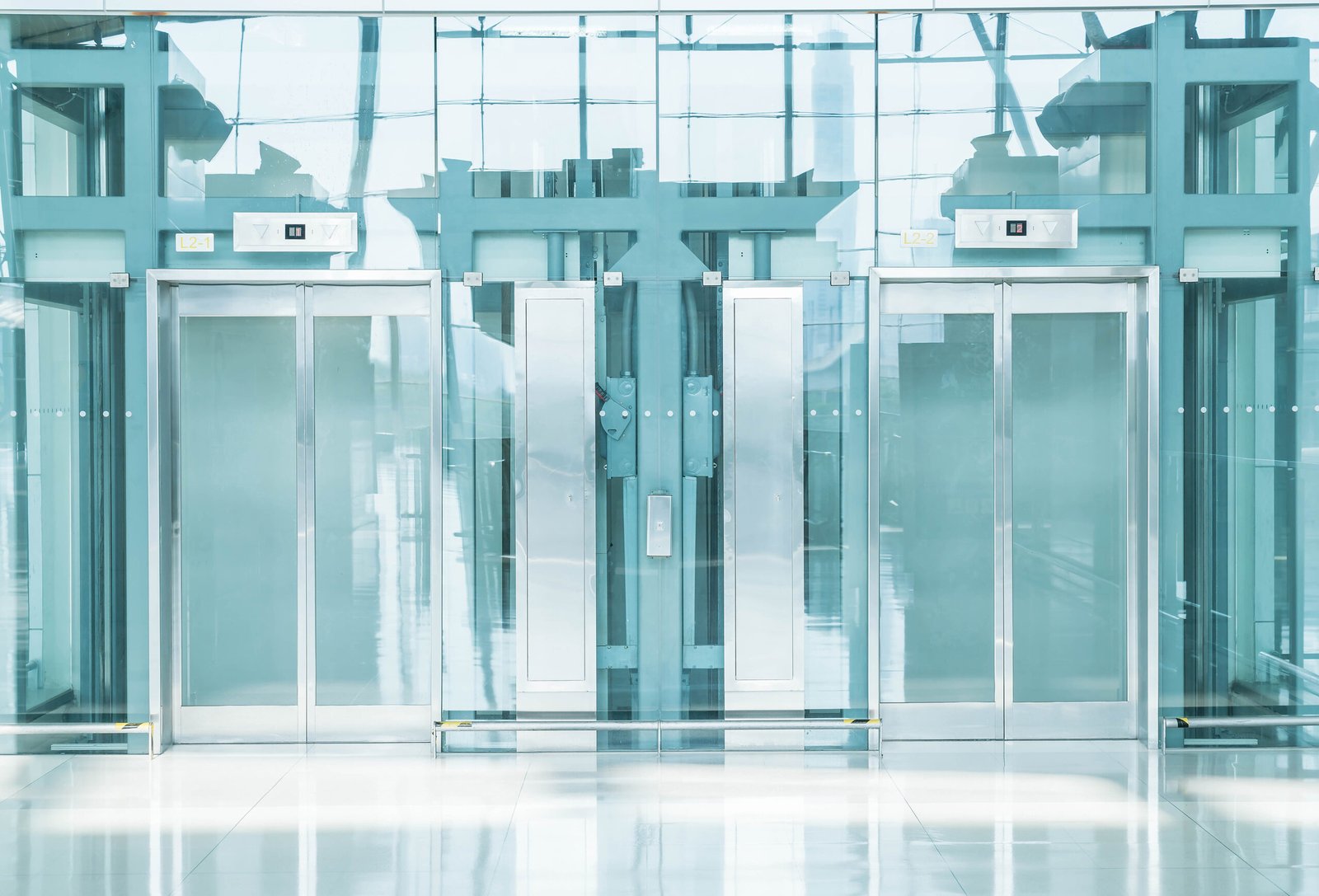 Transparent elevator in underground passage - blue white balance processing